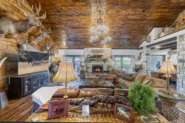 a room with lots of furniture and a chandelier