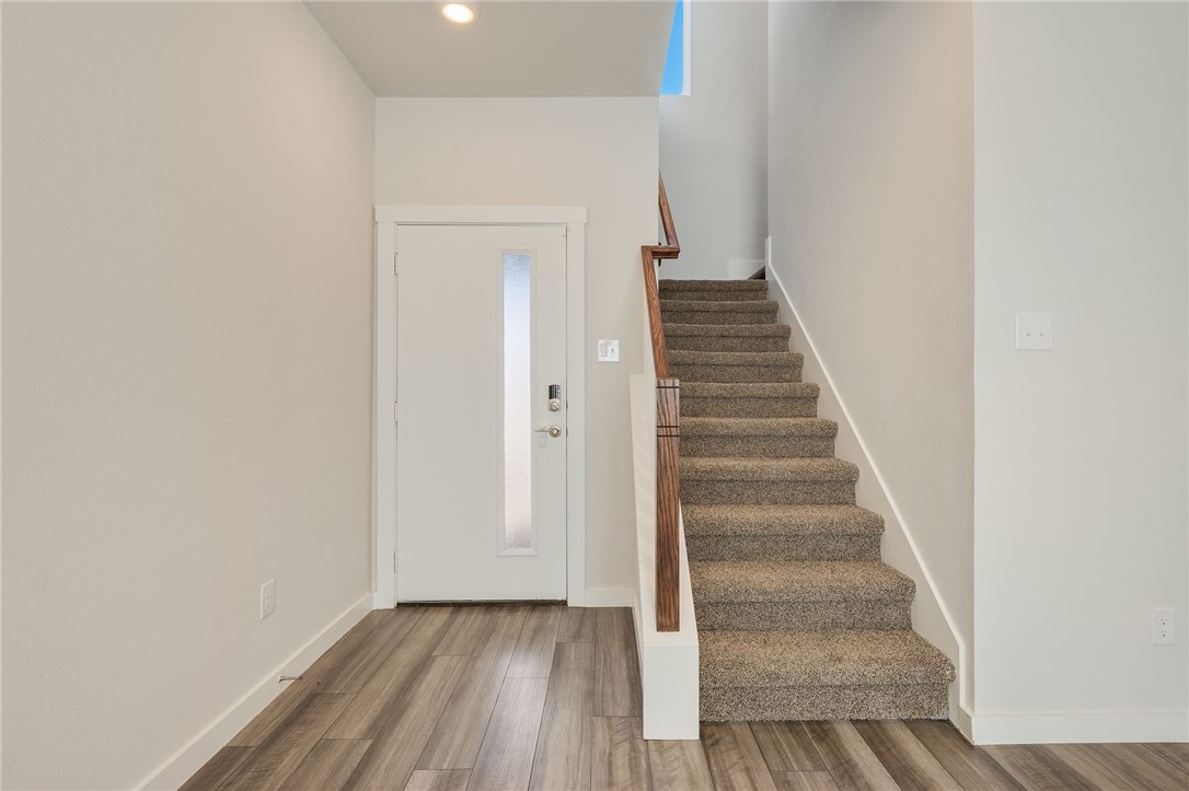 768 Double Mountain Road College Station, TX 77845 - Photo 14 of 28 a view of a hallway with wooden floor and entryway