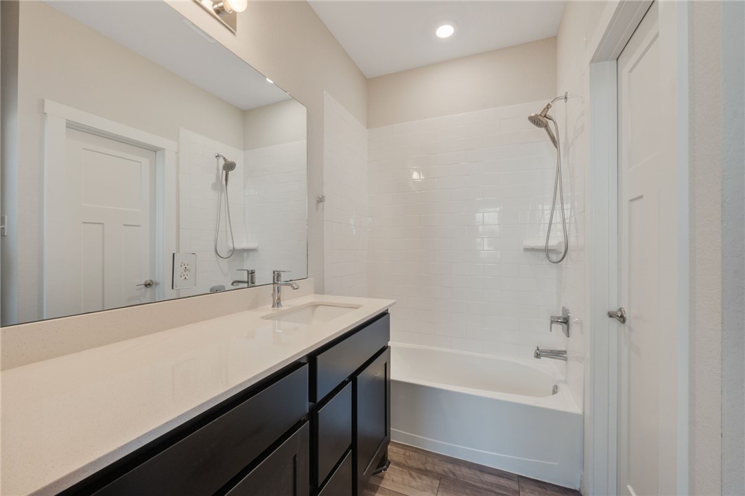 768 Double Mountain Road College Station, TX 77845 - Photo 23 of 28 a bathroom with a bathtub and a sink