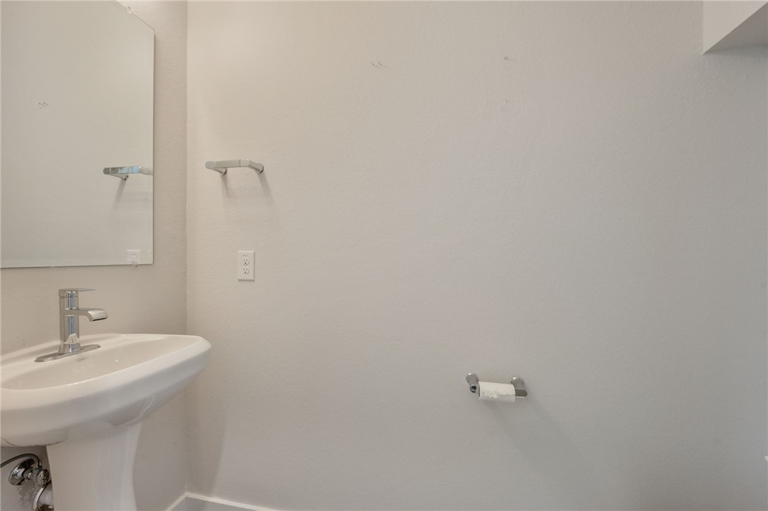 768 Double Mountain Road College Station, TX 77845 - Photo 9 of 28 a bathroom with a sink and mirror