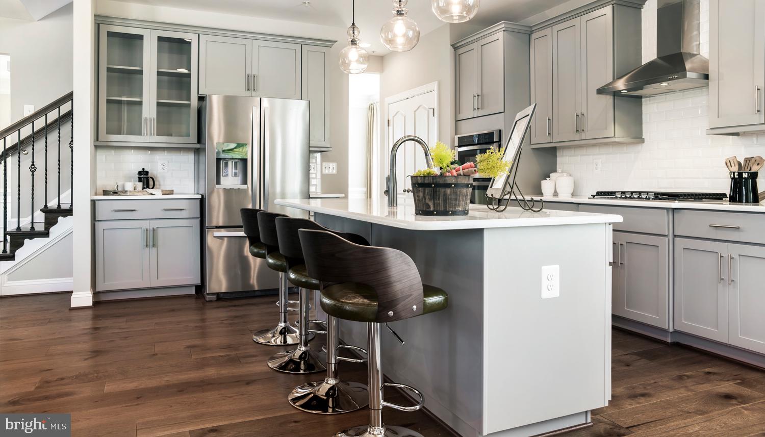 161 Silverleaf Drive Charles Town, WV 25414 - Photo 2 of 14 a kitchen with stainless steel appliances granite countertop a stove a sink dishwasher and a refrigerator with wooden floor