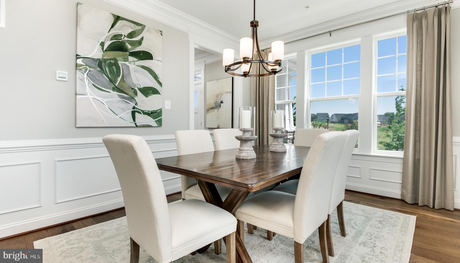 161 Silverleaf Drive Charles Town, WV 25414 - Photo 5 of 14 a view of a dining room with furniture window and wooden floor