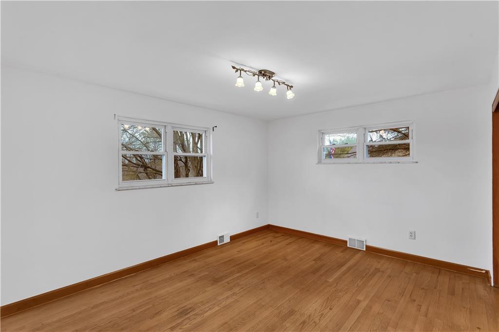 138 Sunset Lane Aliquippa, PA 15001 - Photo 15 of 31 a view of empty room with wooden floor