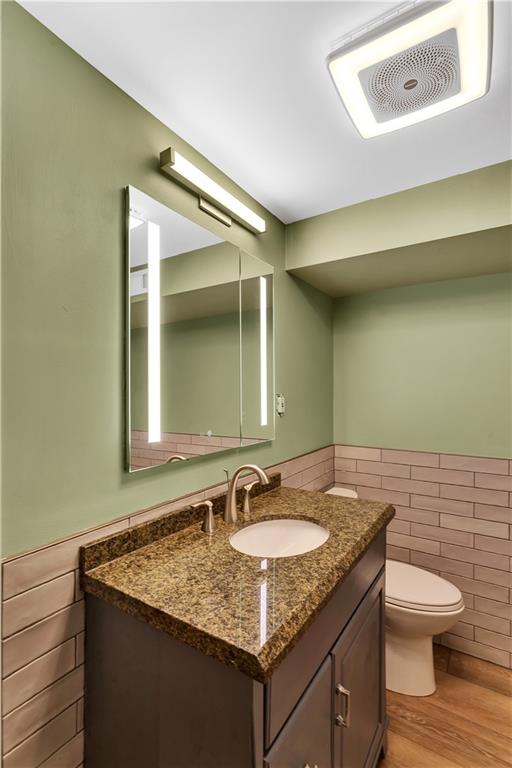 138 Sunset Lane Aliquippa, PA 15001 - Photo 17 of 31 a bathroom with a granite countertop sink and a mirror