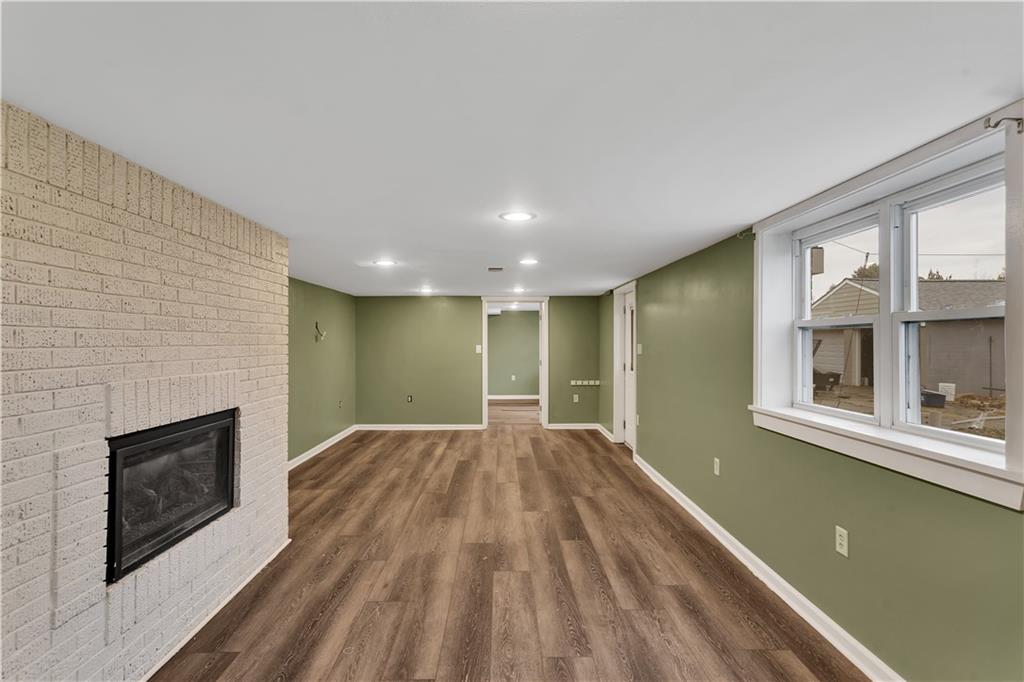 138 Sunset Lane Aliquippa, PA 15001 - Photo 24 of 31 an empty room with large windows and fireplace