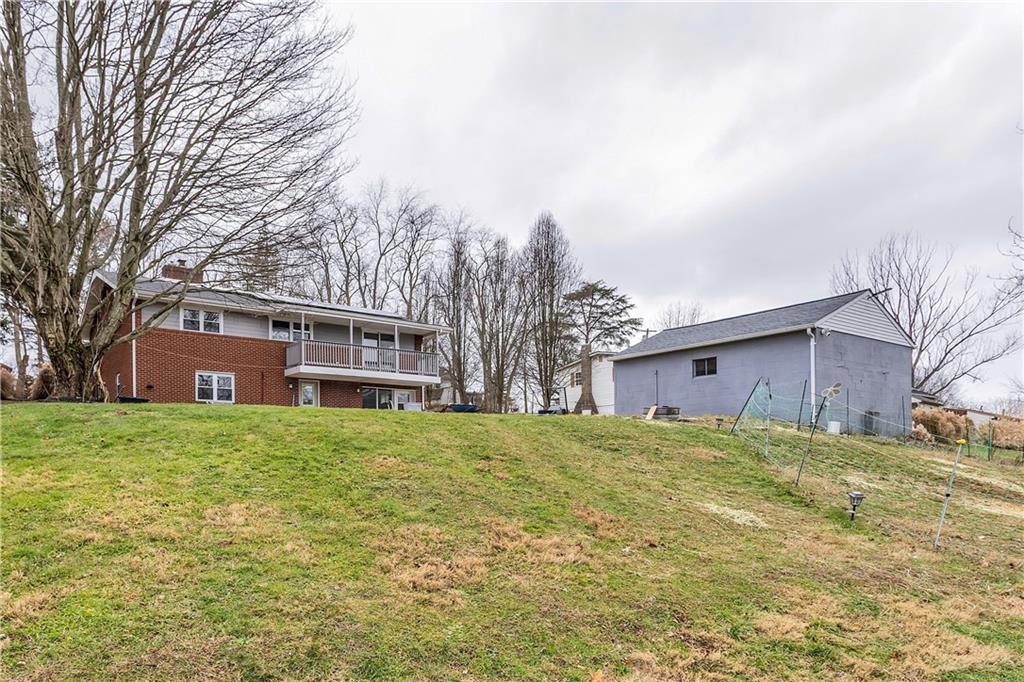 138 Sunset Lane Aliquippa, PA 15001 - Photo 27 of 31 a front view of house with yard and trees