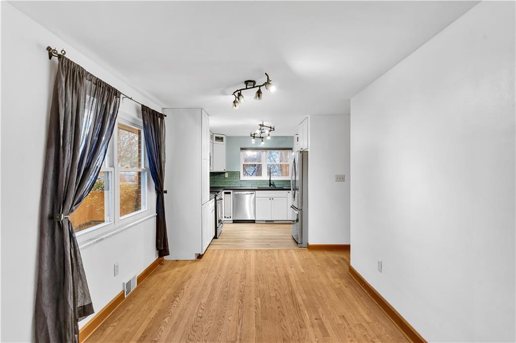 138 Sunset Lane Aliquippa, PA 15001 - Photo 6 of 31 a view of a kitchen with wooden floor and electronic appliances