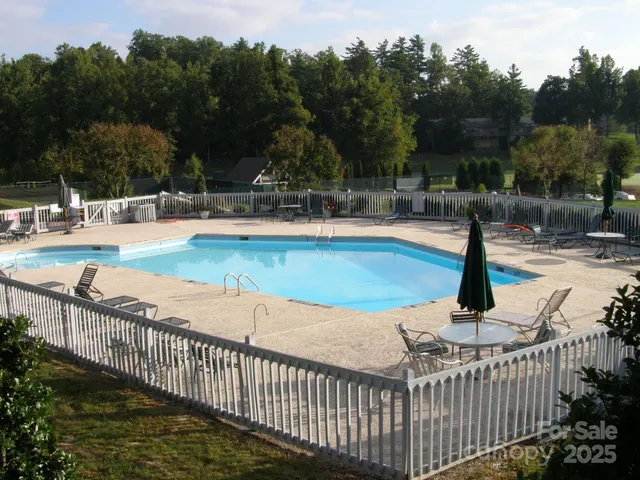 a view of a swimming pool with a patio