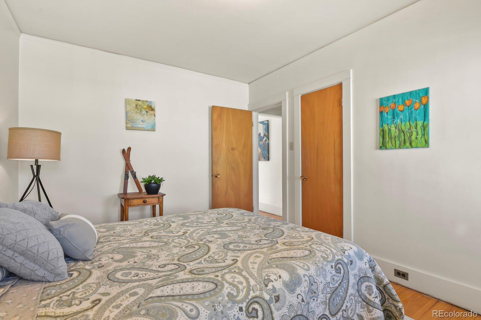 4537 Quitman Street Denver, CO 80212 - Photo 11 of 38 a bedroom with a bed and a lamp