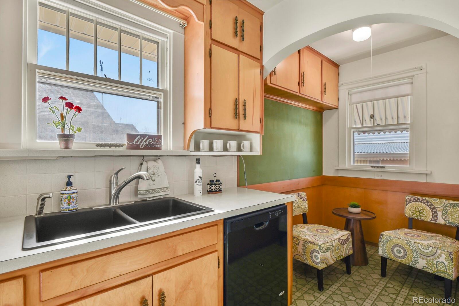 4537 Quitman Street Denver, CO 80212 - Photo 17 of 38 a bathroom with a sink and a mirror