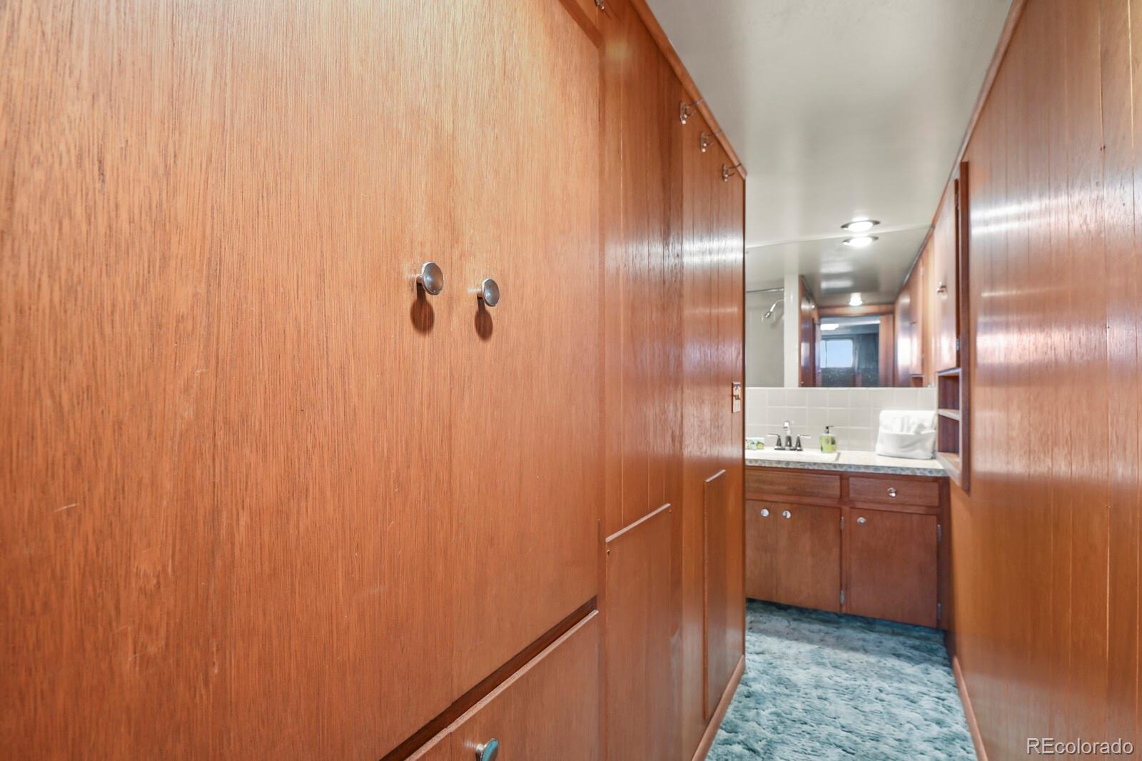 4537 Quitman Street Denver, CO 80212 - Photo 23 of 38 a bathroom with a granite countertop sink and a mirror