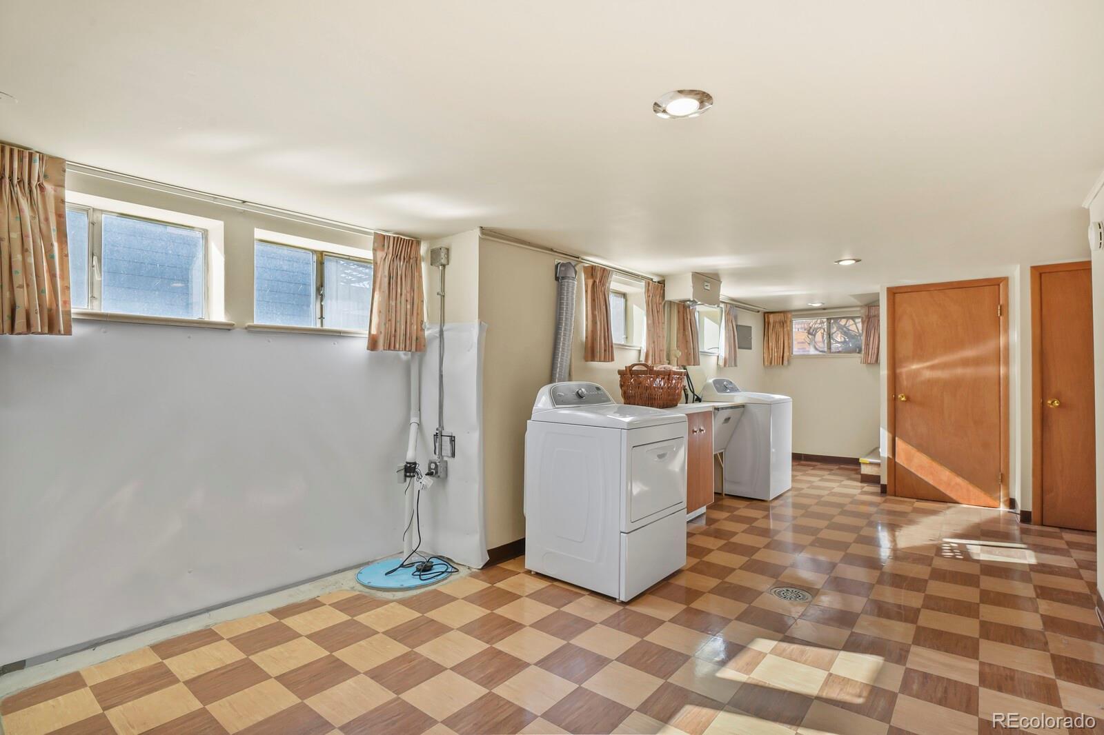 4537 Quitman Street Denver, CO 80212 - Photo 28 of 38 a view of a storage & utility room with two washing machine