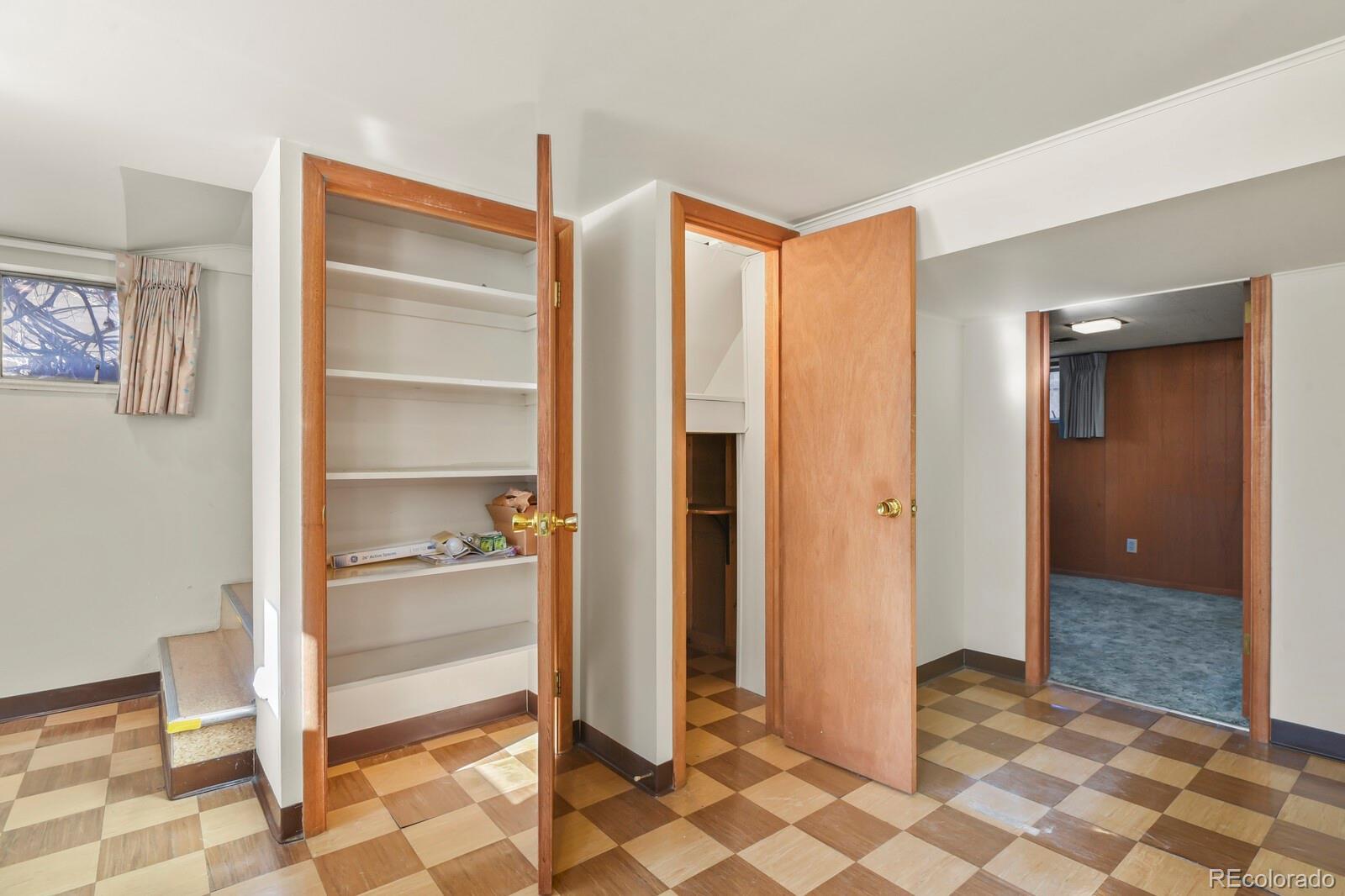 4537 Quitman Street Denver, CO 80212 - Photo 29 of 38 a view of a hallway with closet and bathroom