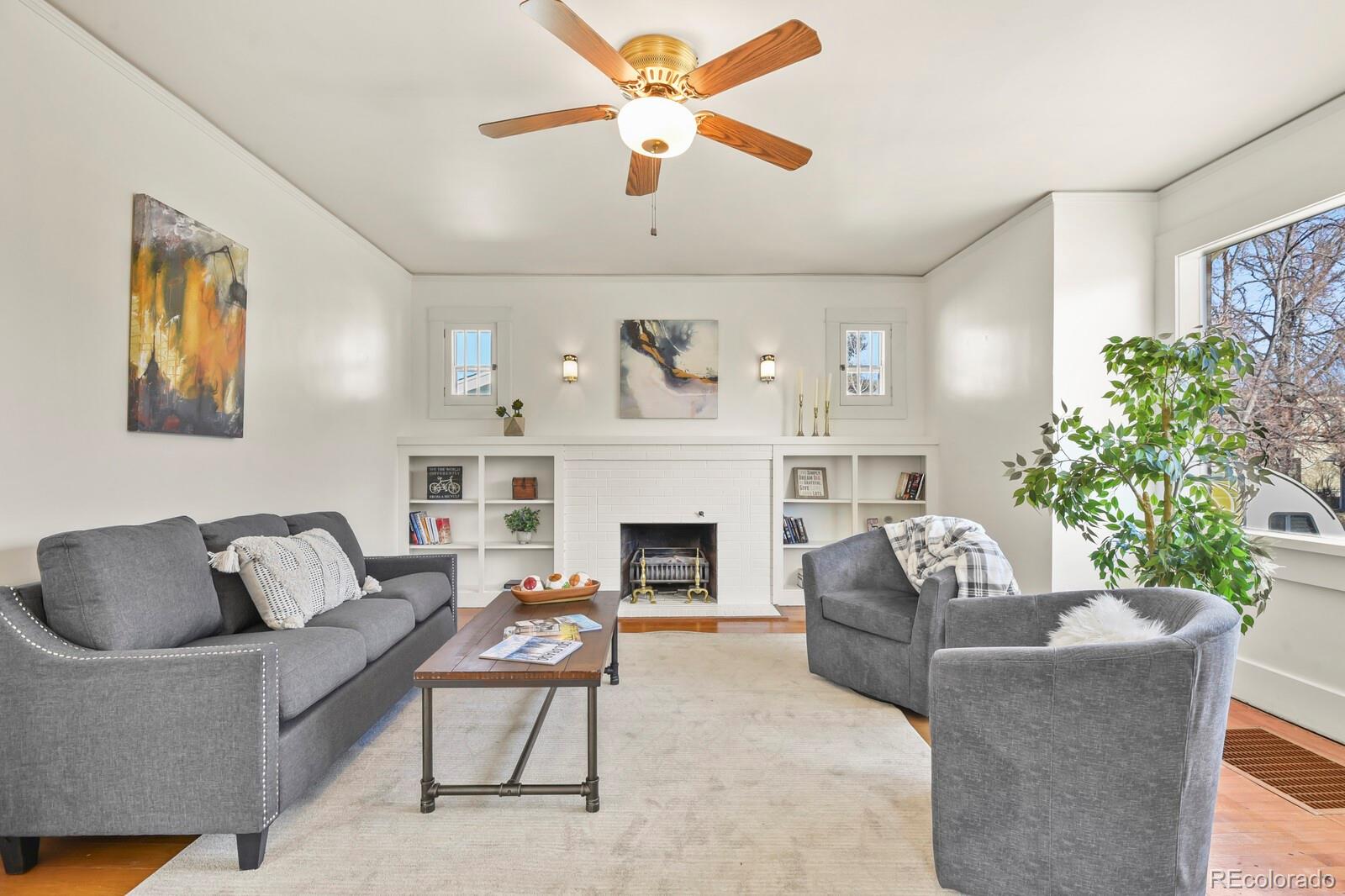 4537 Quitman Street Denver, CO 80212 - Photo 4 of 38 a living room with furniture fireplace and a large window