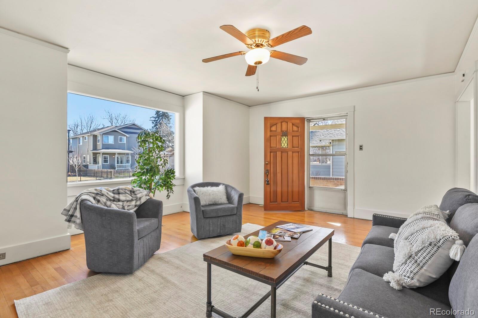 4537 Quitman Street Denver, CO 80212 - Photo 5 of 38 a living room with furniture potted plant and a window