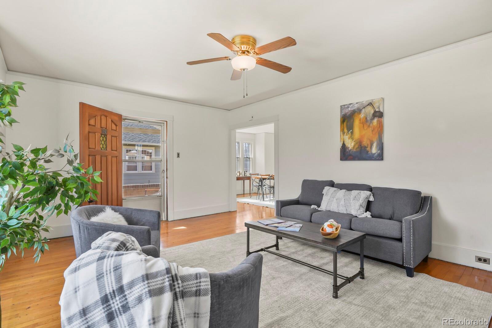4537 Quitman Street Denver, CO 80212 - Photo 6 of 38 a living room with furniture and a potted plant