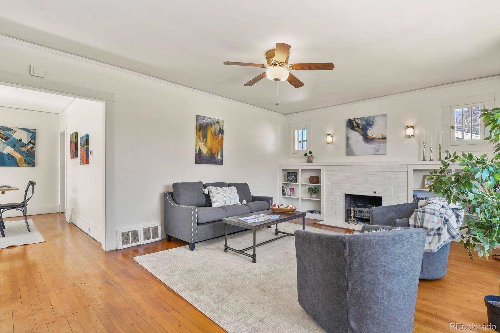 4537 Quitman Street Denver, CO 80212 - Photo 7 of 38 a living room with furniture and a fireplace