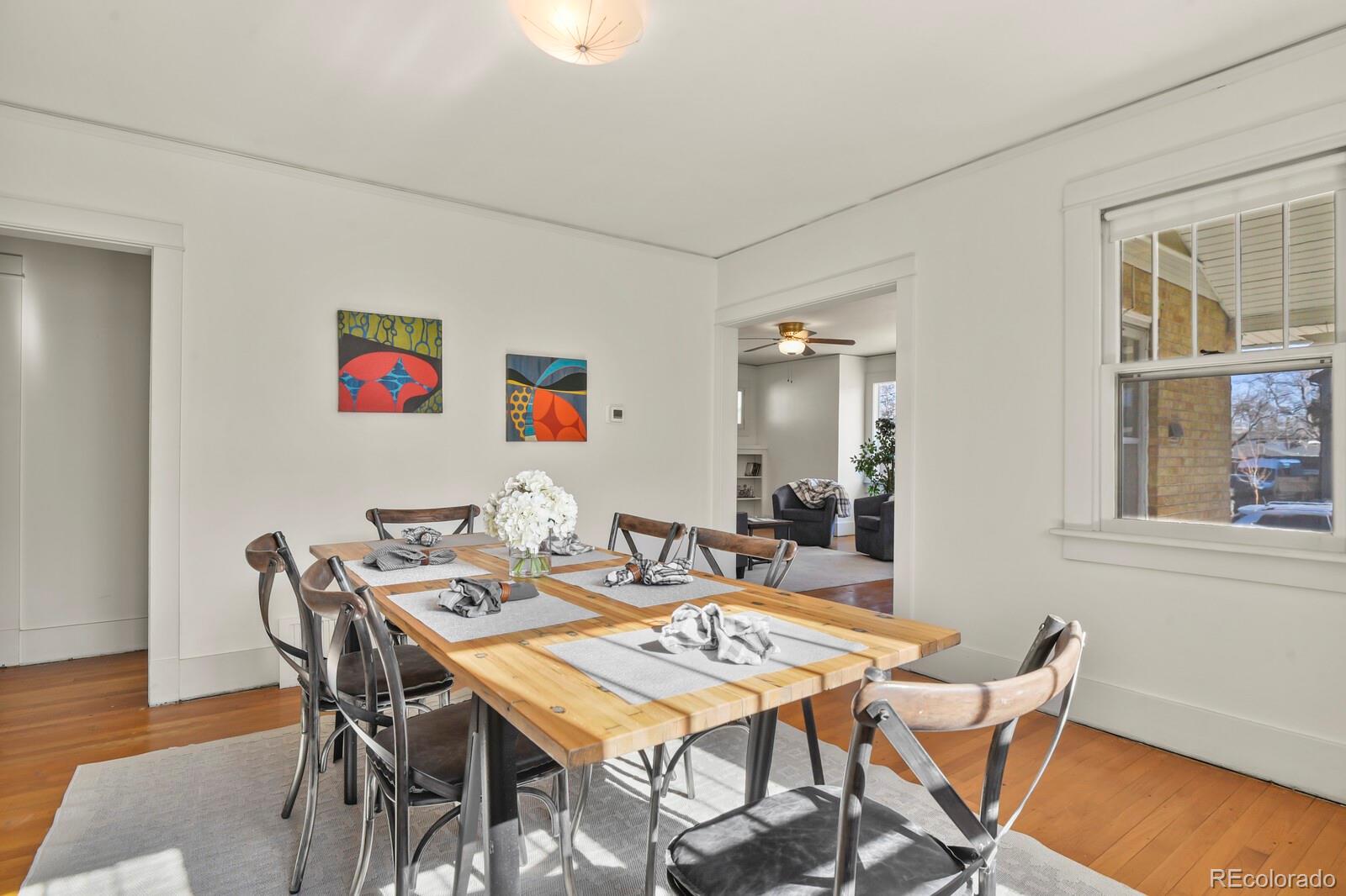 4537 Quitman Street Denver, CO 80212 - Photo 9 of 38 a view of a dining room with furniture and wooden floor