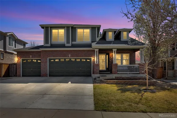 a front view of a house with yard