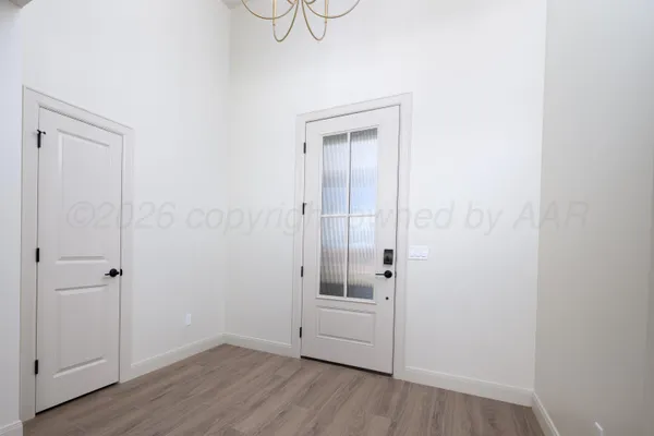 a white bath tub sitting in a bathroom next to a window