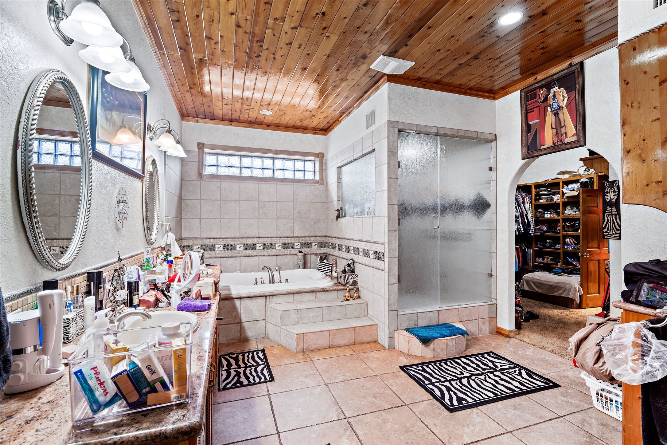 7438 Wright Road Houston, TX 77041 - Photo 11 of 50 The primary bath room with jacuzzi tub and lighted massaging walk in shower. Separate vanities and large walk closet.