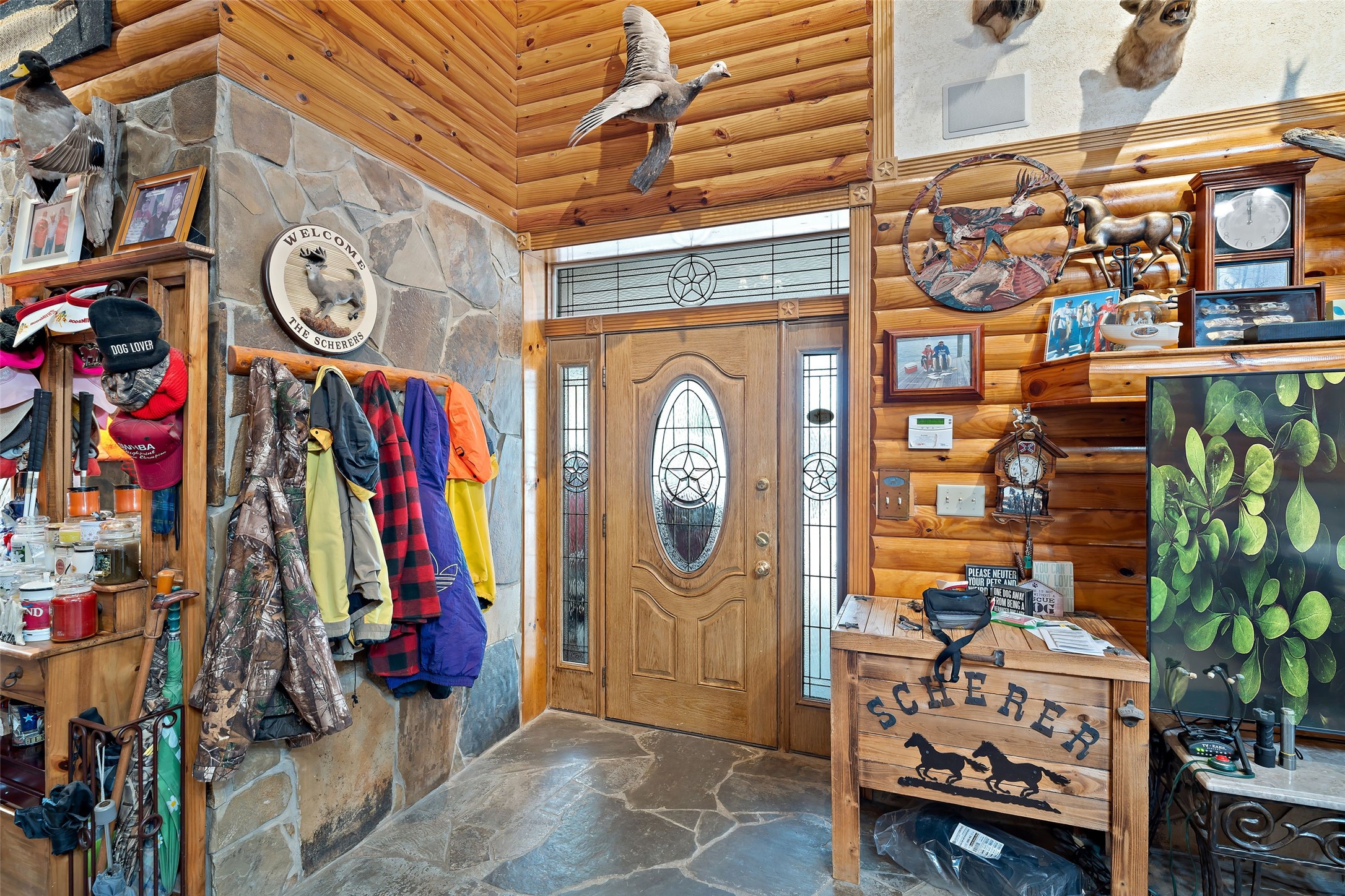 7438 Wright Road Houston, TX 77041 - Photo 3 of 50 As you enter the home and look back look at the stone work and cabin feel.