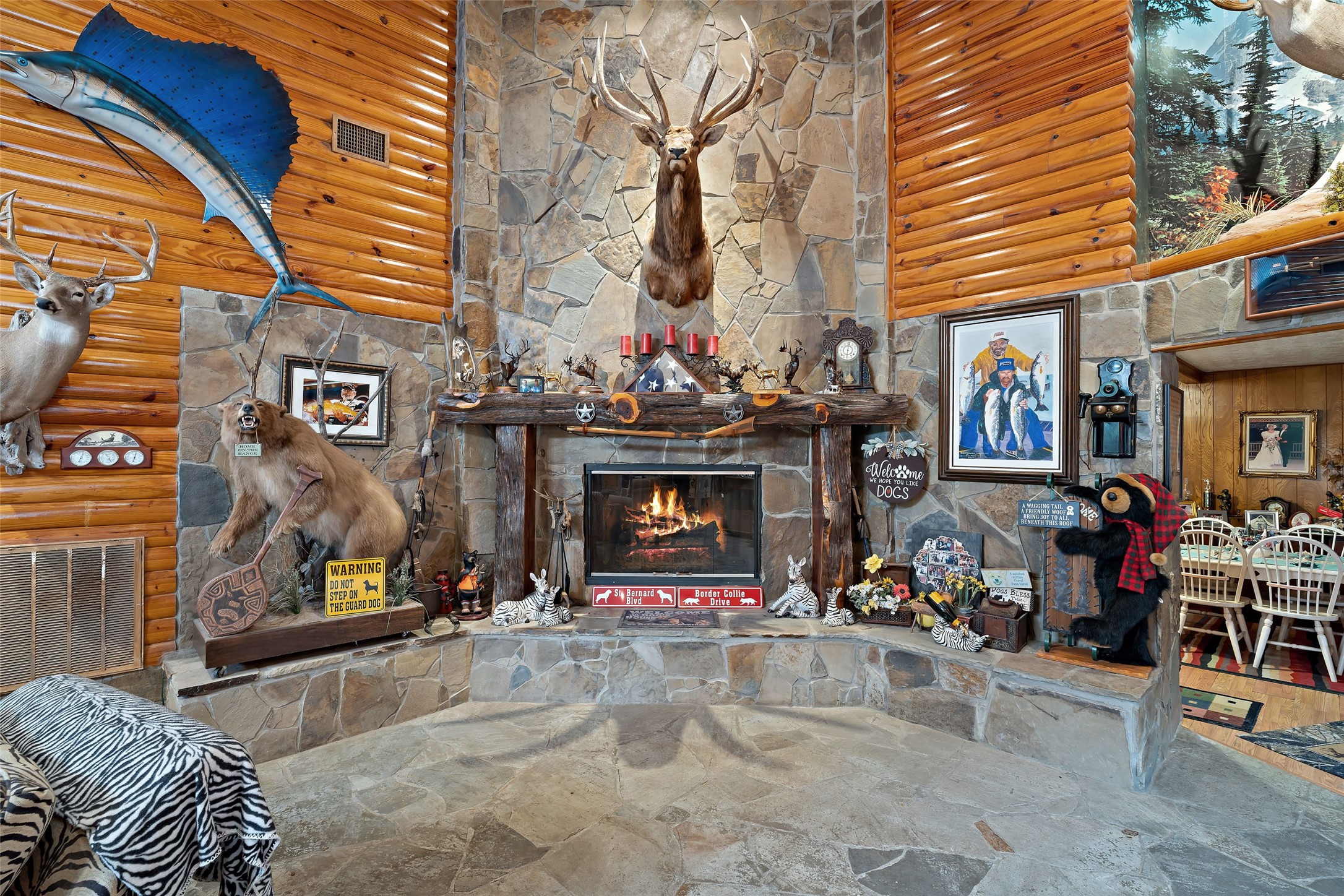 7438 Wright Road Houston, TX 77041 - Photo 8 of 50 The large fireplace with floor to ceiling stone fire place with the rustic mantel.