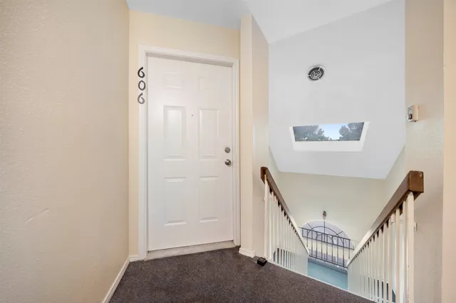 a view of a hallway with windows