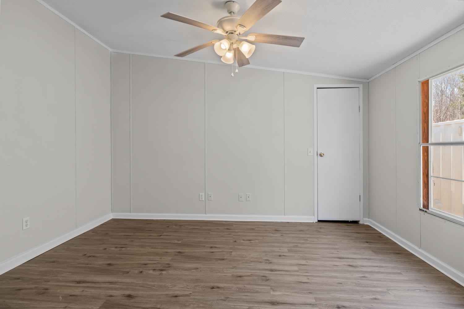 624 Nickletown Road Sugar Tree, TN 38380 - Photo 34 of 45 wooden floor in an empty room with a window