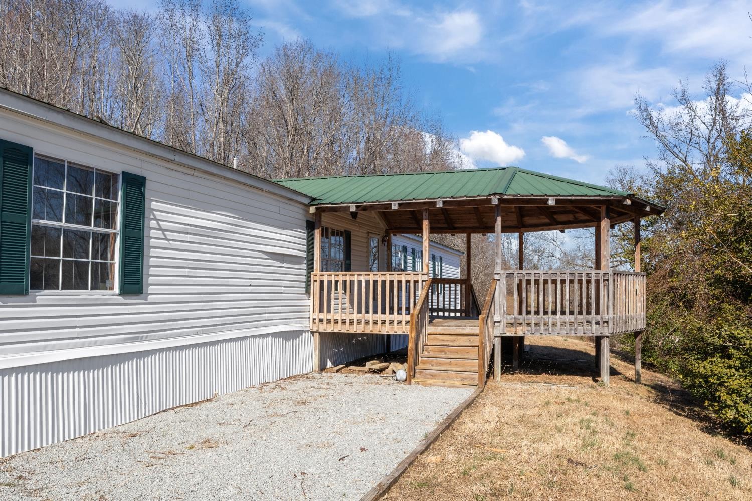 624 Nickletown Road Sugar Tree, TN 38380 - Photo 5 of 45 a porch with a bench in front of house