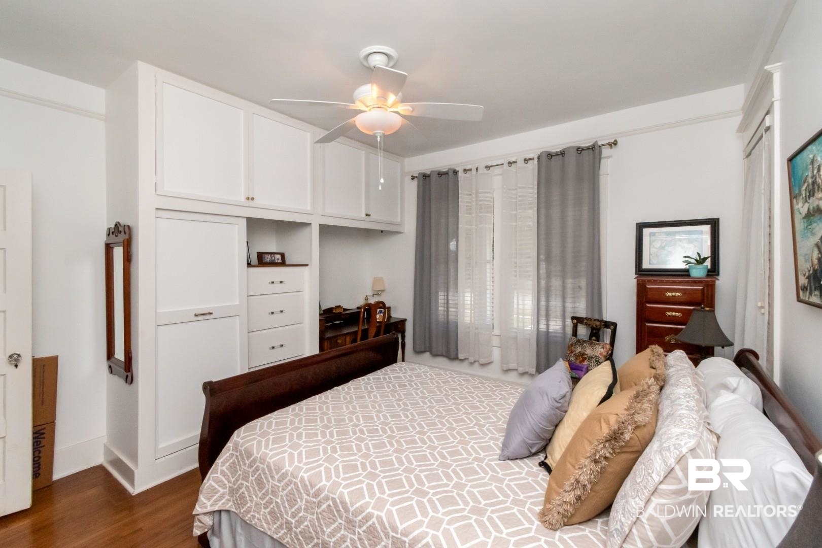 135 Silverwood Street Mobile, AL 36607 - Photo 18 of 32 Bedroom with a closet, dark wood-style flooring, and a ceiling fan