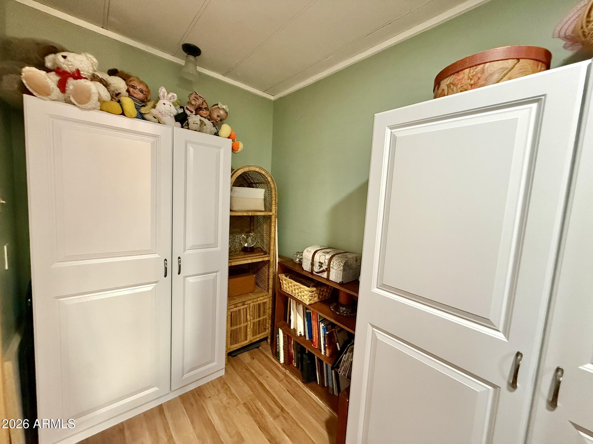 201 South Greenfield Road, Unit 246 Mesa, AZ 85206 - Photo 21 of 42 a view of walk in closet with wooden floor