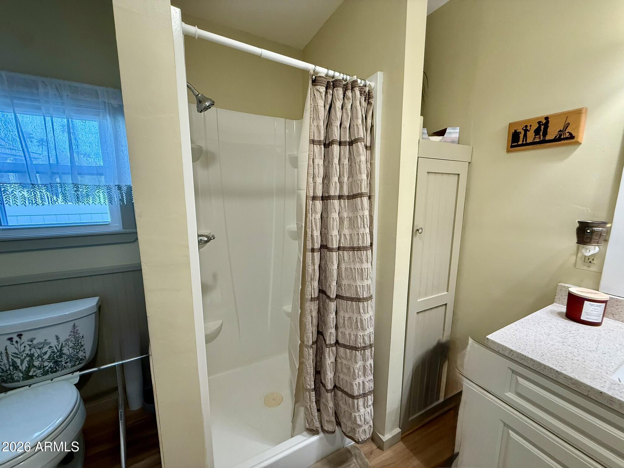 201 South Greenfield Road, Unit 246 Mesa, AZ 85206 - Photo 24 of 42 a bathroom with a shower and a sink
