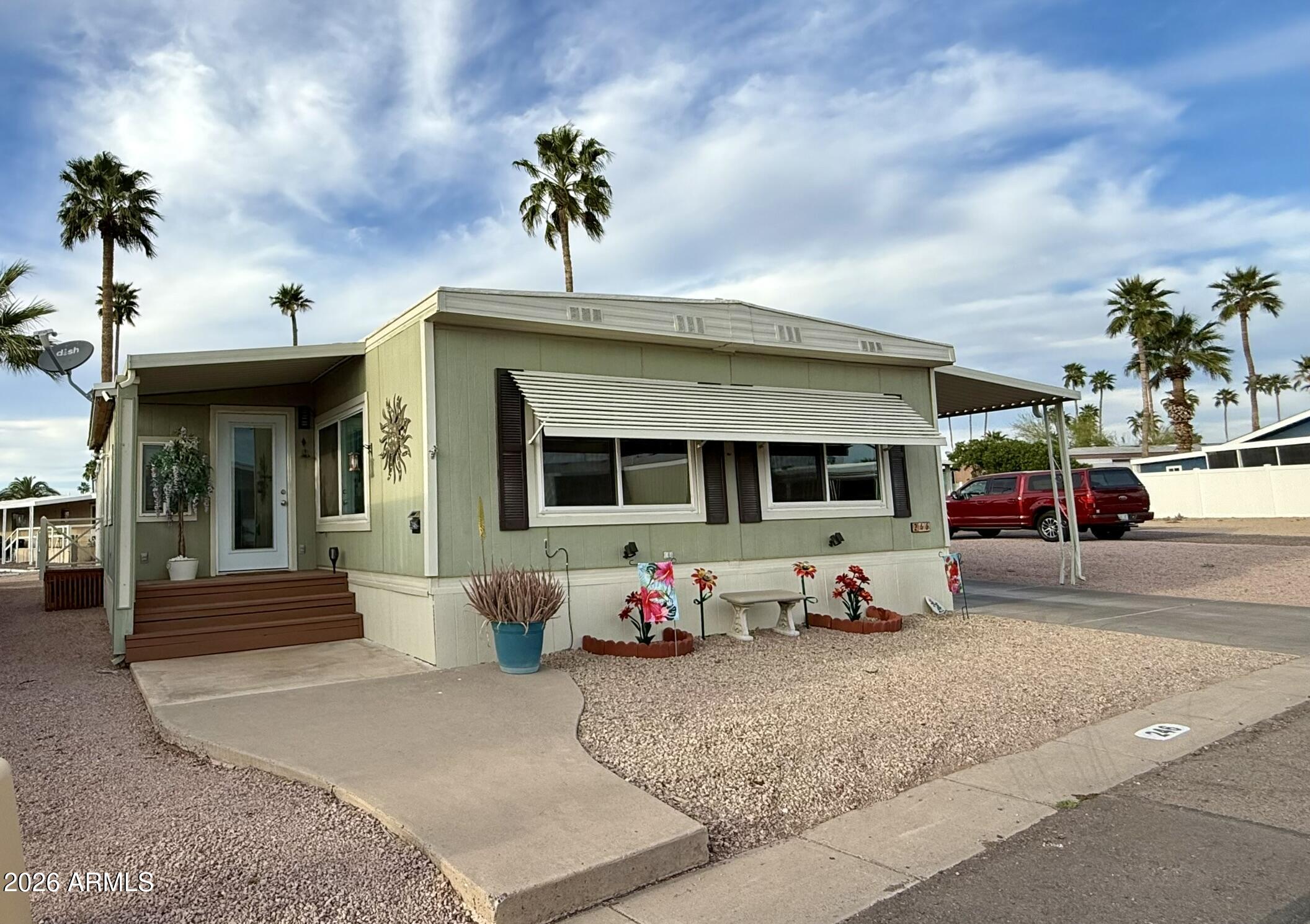 201 South Greenfield Road, Unit 246 Mesa, AZ 85206 - Photo 31 of 42 a front view of a house with a yard outdoor seating area