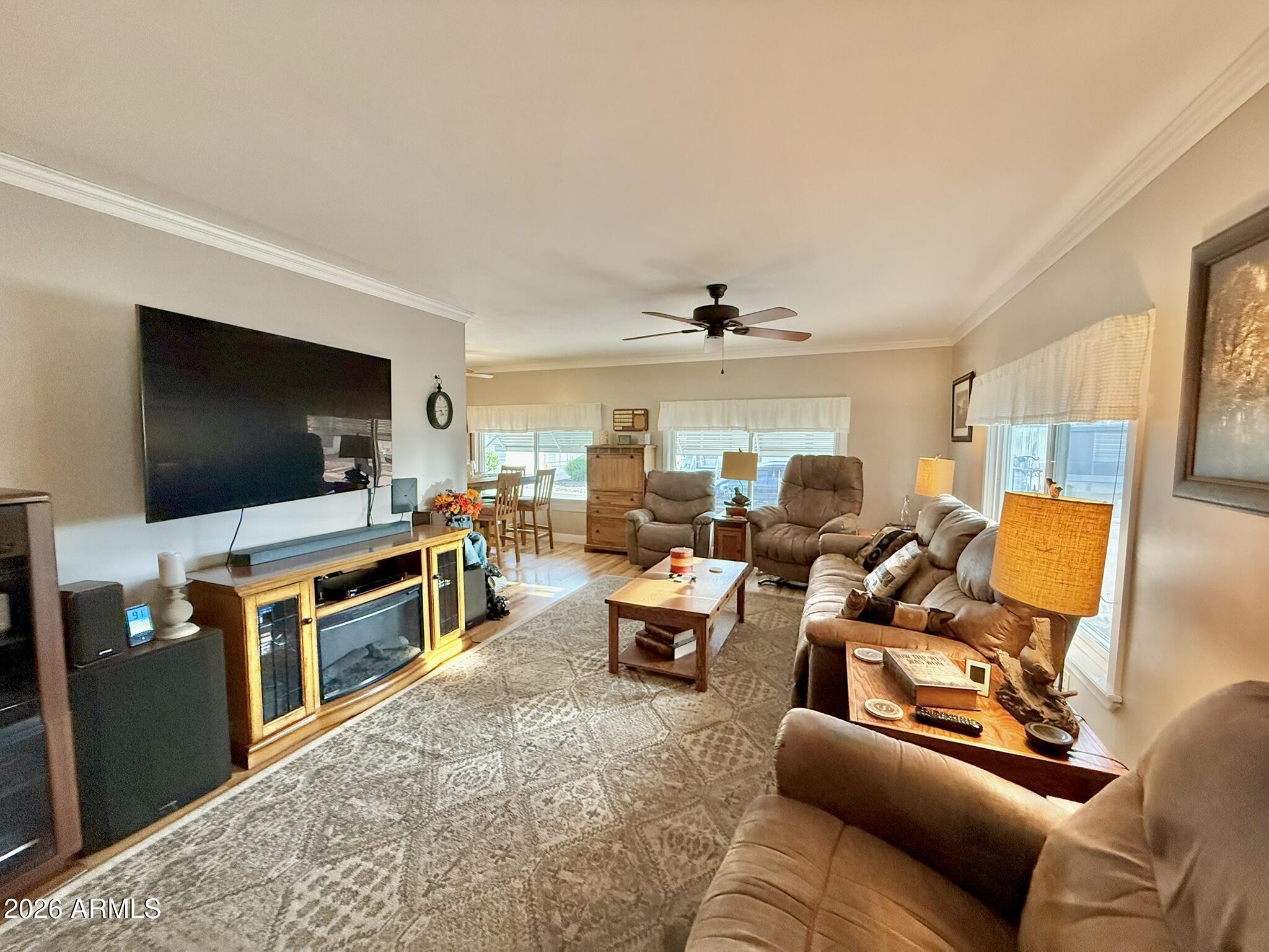 201 South Greenfield Road, Unit 246 Mesa, AZ 85206 - Photo 6 of 42 a living room with furniture and a flat screen tv