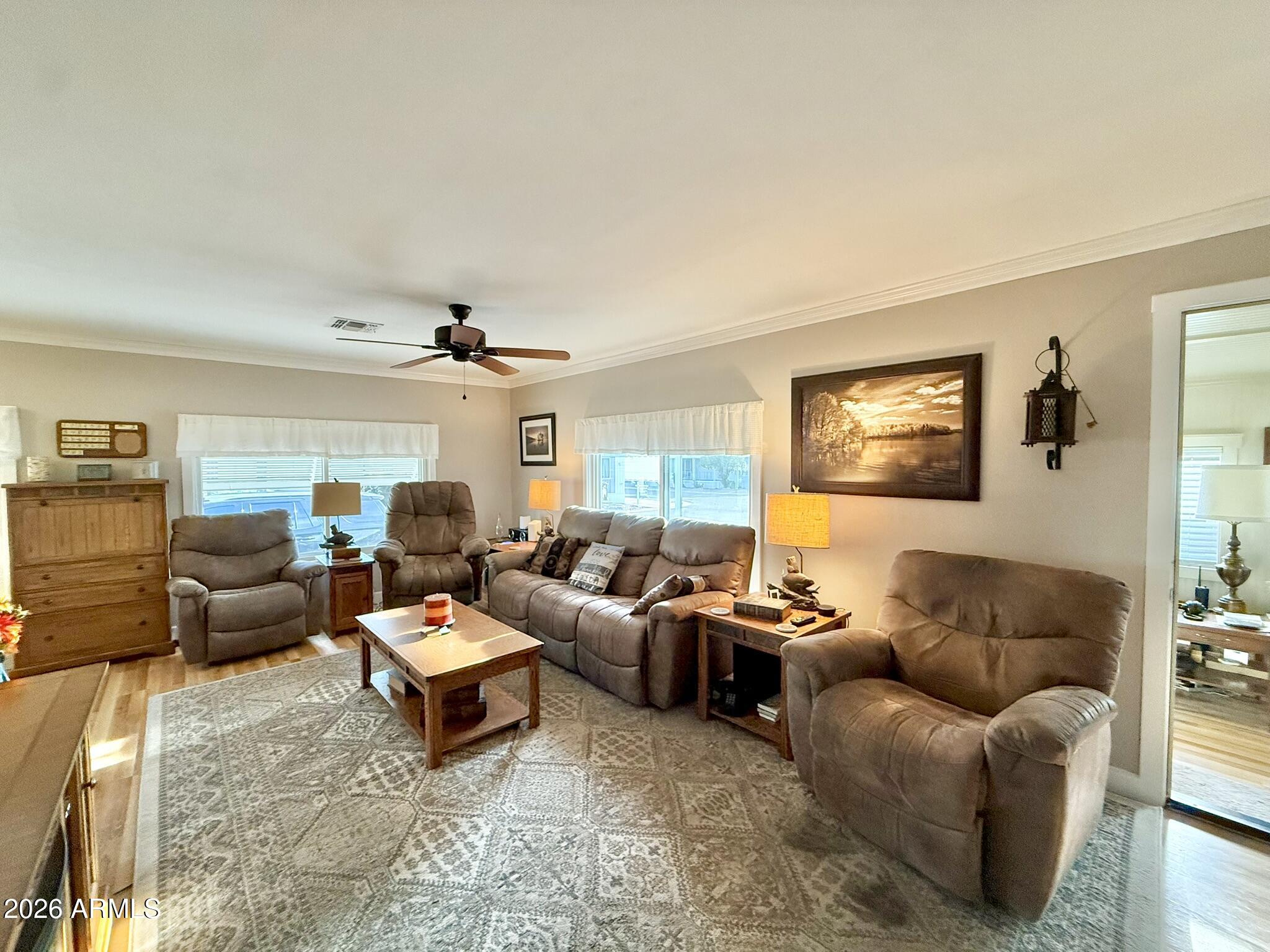 201 South Greenfield Road, Unit 246 Mesa, AZ 85206 - Photo 7 of 42 a living room with furniture and a flat screen tv