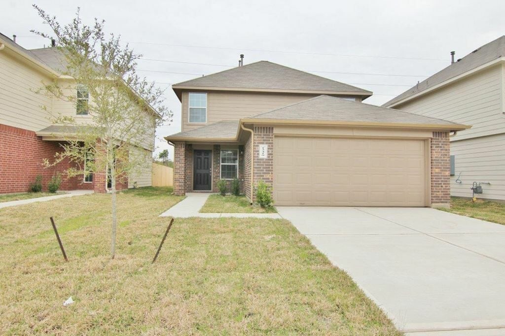 12419 Gemma Lane Houston, TX 77044 - Photo 1 of 15 a front view of a house with a yard