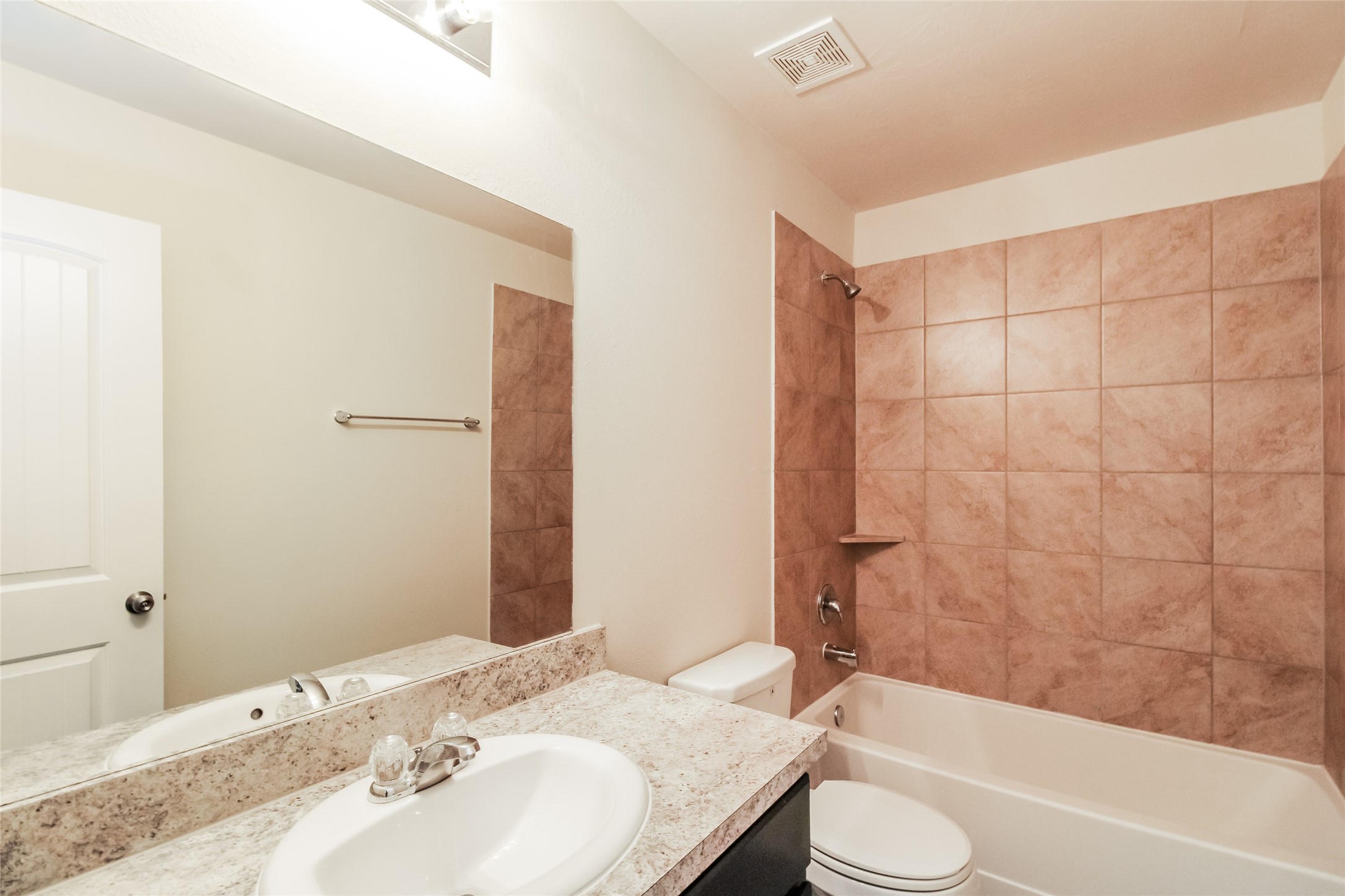 12419 Gemma Lane Houston, TX 77044 - Photo 8 of 15 a bathroom with a granite countertop sink toilet and shower