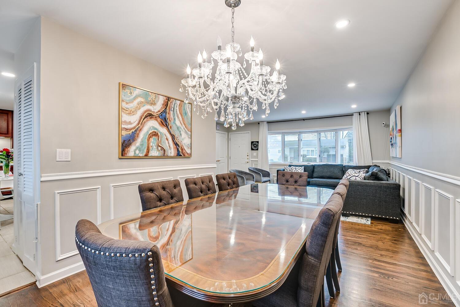 12 Eardley Road Edison, NJ 08817 - Photo 12 of 36 a dining room with furniture a chandelier and wooden floor