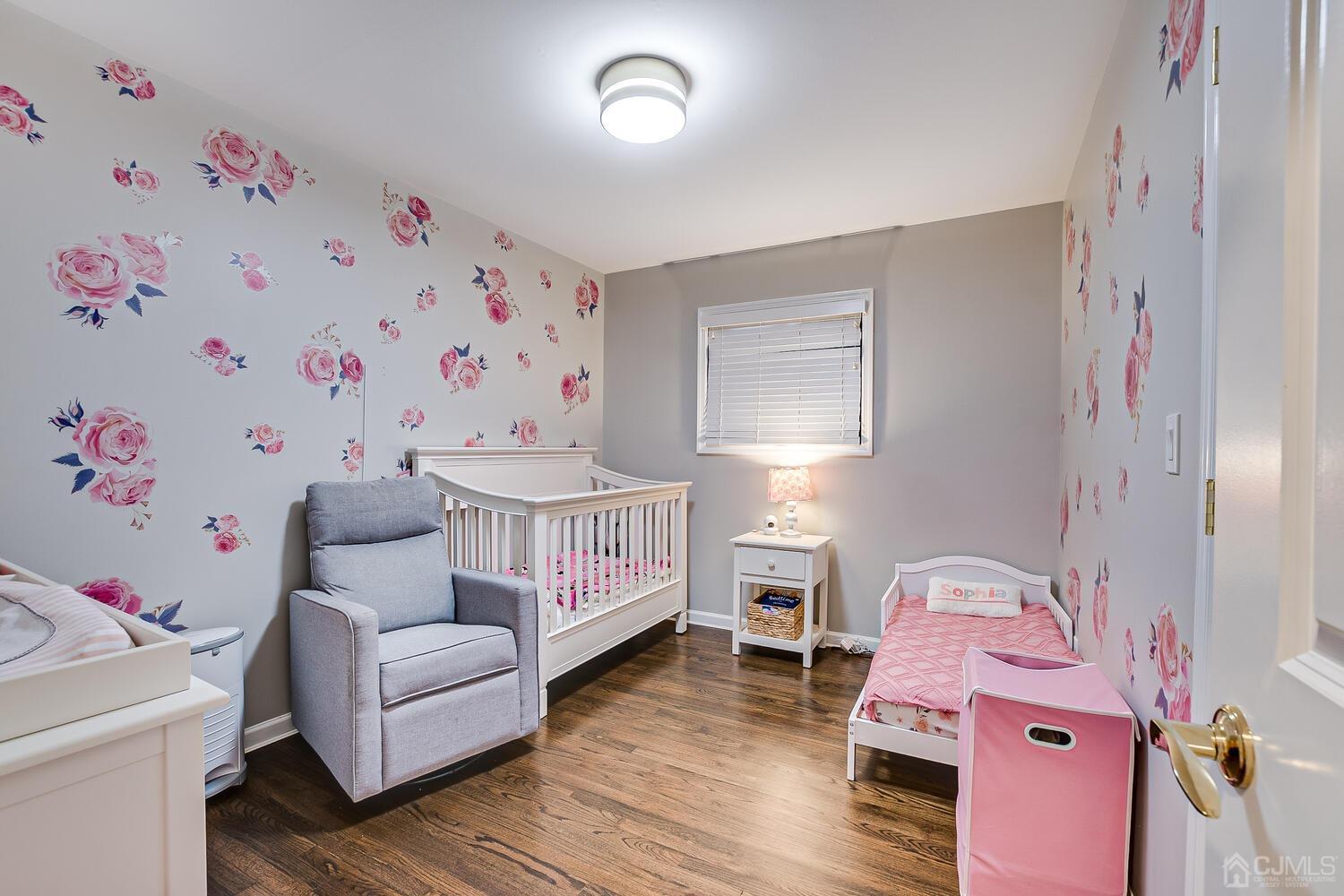 12 Eardley Road Edison, NJ 08817 - Photo 22 of 36 a bedroom with furniture and a baby crib