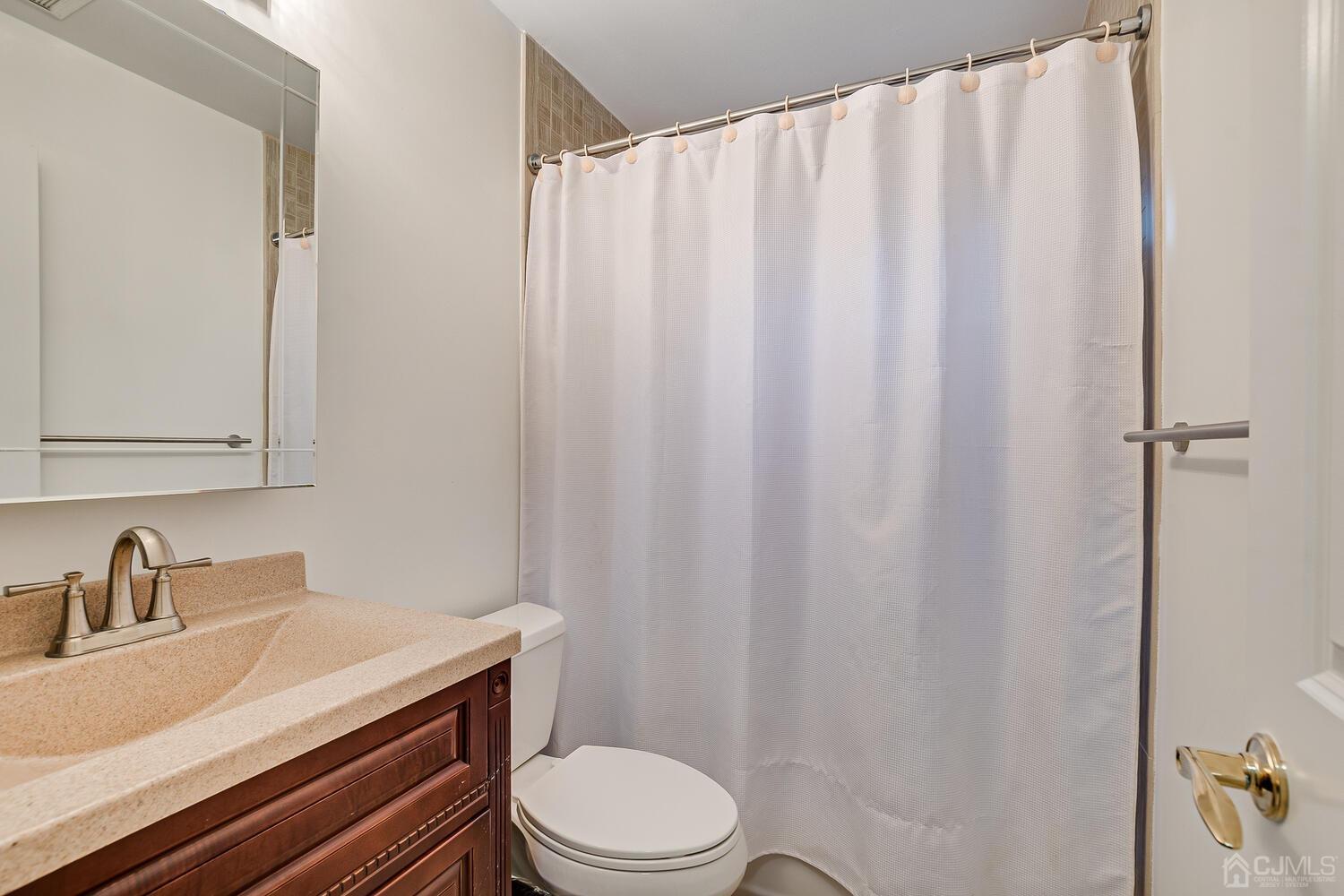12 Eardley Road Edison, NJ 08817 - Photo 24 of 36 a bathroom with a sink and a toilet