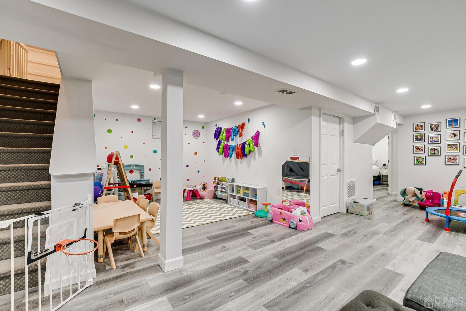 12 Eardley Road Edison, NJ 08817 - Photo 25 of 36 a play room with furniture and a flat screen tv