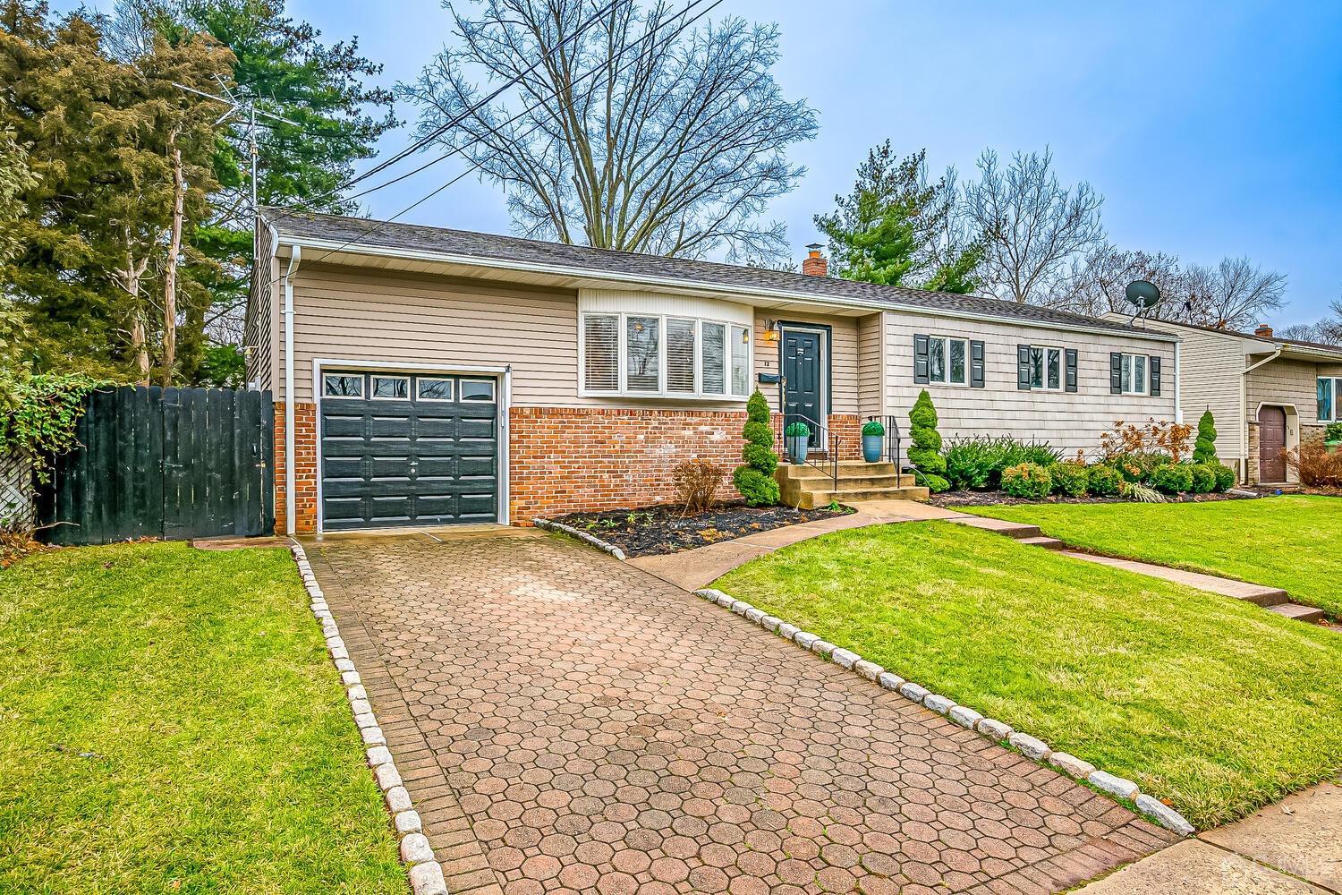 12 Eardley Road Edison, NJ 08817 - Photo 3 of 36 a front view of a house with a yard and trees