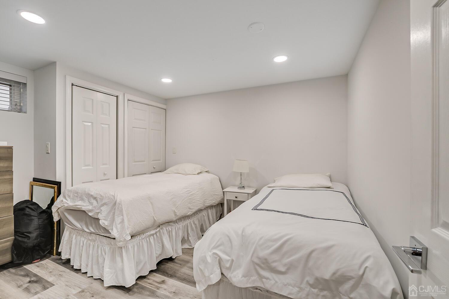 12 Eardley Road Edison, NJ 08817 - Photo 32 of 36 a bedroom with two beds and painting on the wall