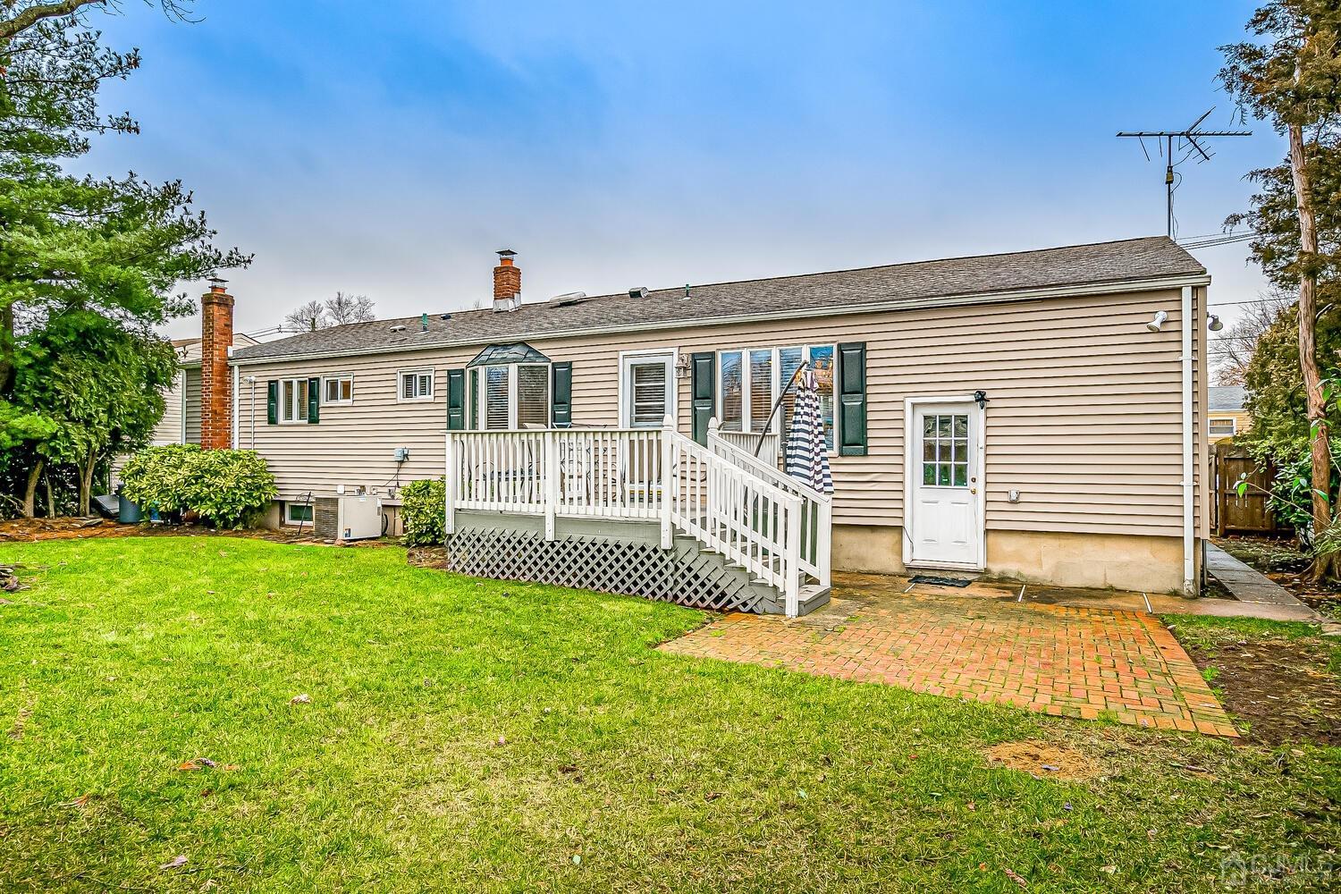 12 Eardley Road Edison, NJ 08817 - Photo 34 of 36 a front view of a house with a garden and yard