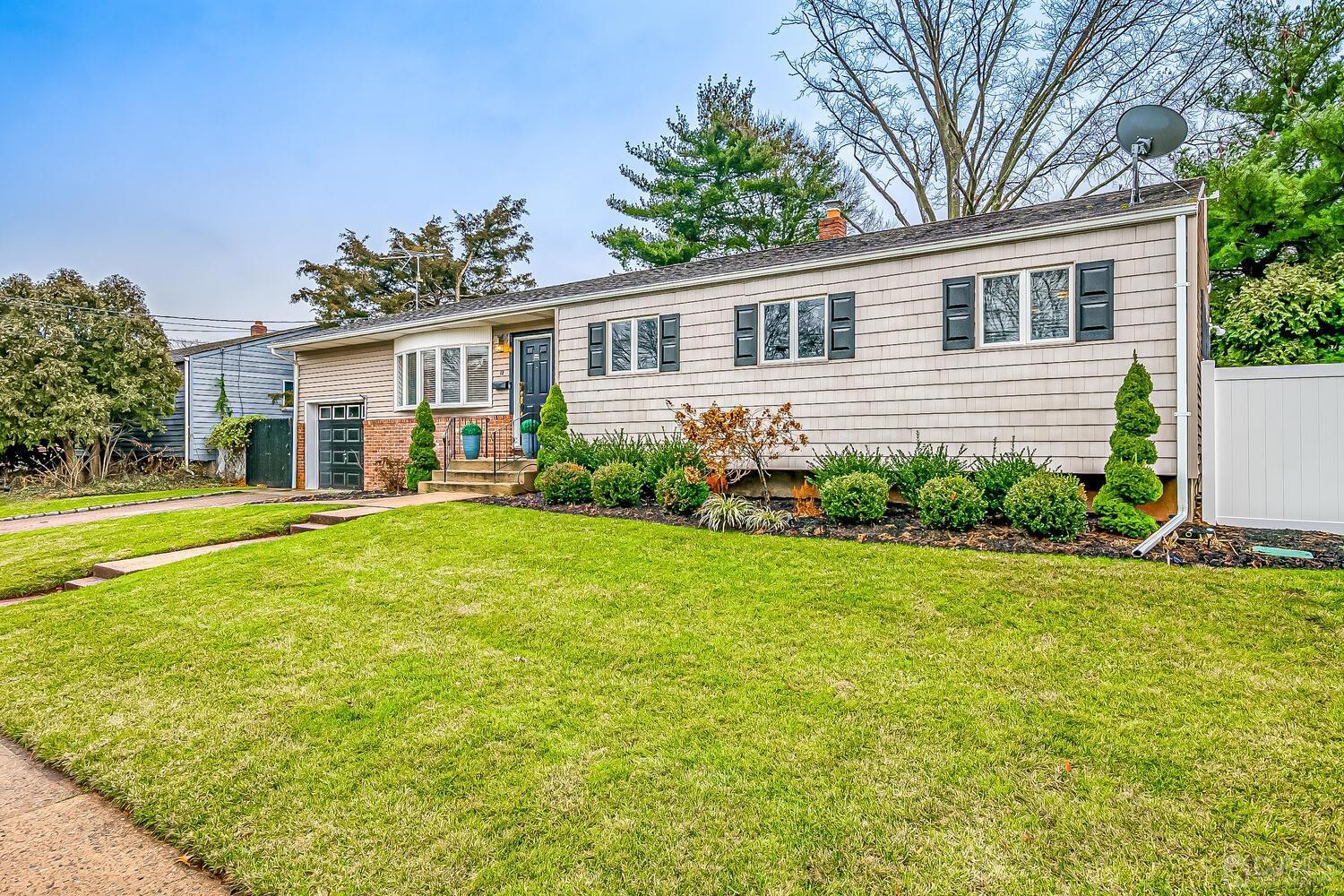 12 Eardley Road Edison, NJ 08817 - Photo 5 of 36 a view of a house with a backyard