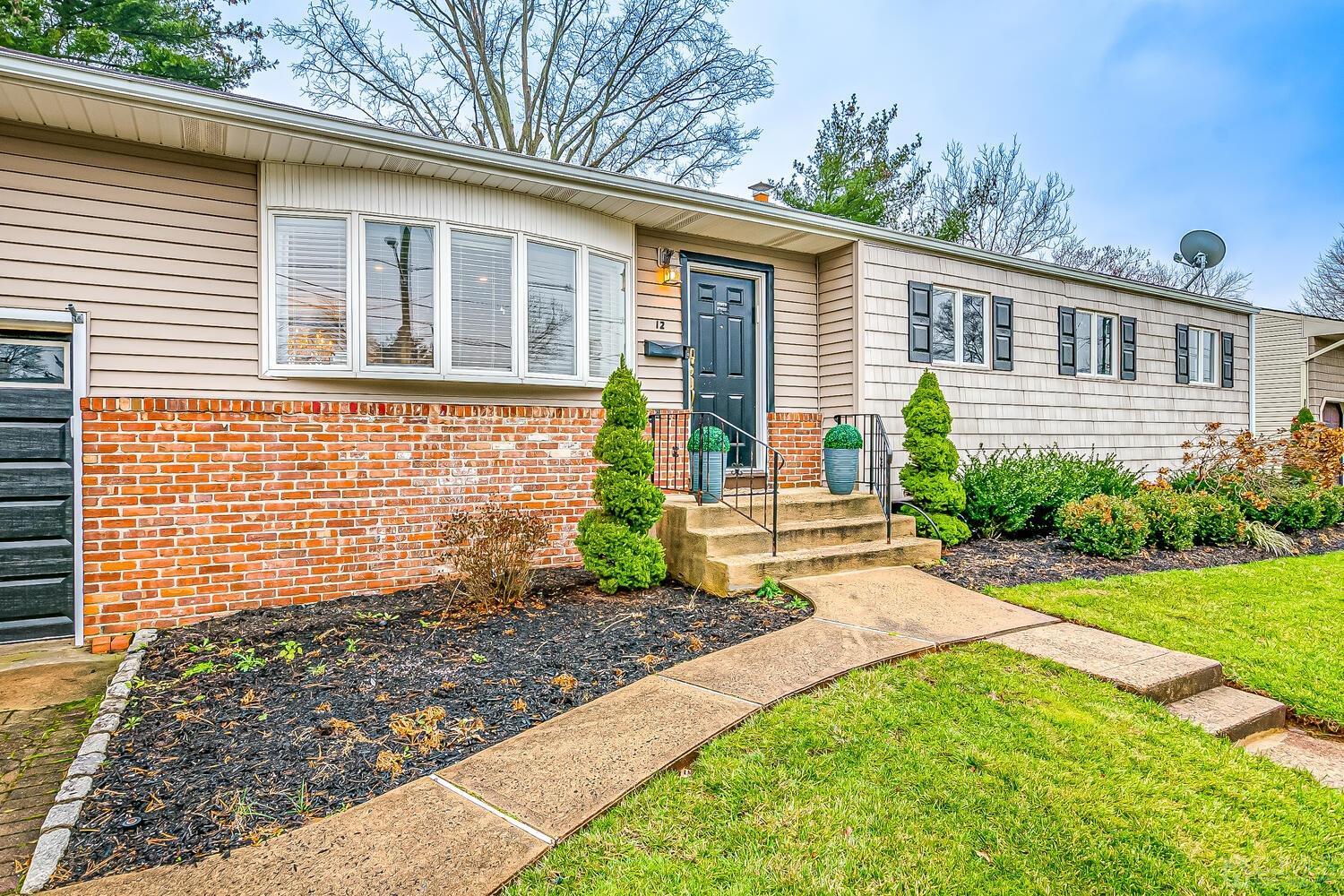 12 Eardley Road Edison, NJ 08817 - Photo 6 of 36 a front view of a house with garden