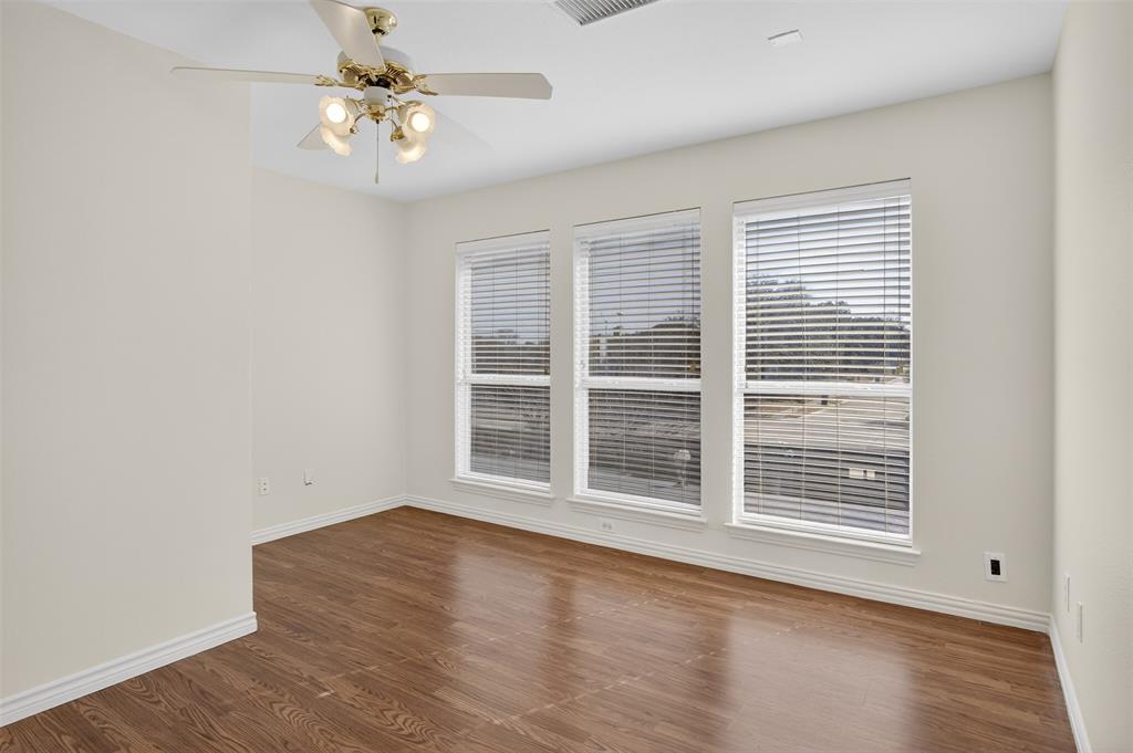 3716 Lowrey Way Plano, TX 75025 - Photo 16 of 28 a view of empty room with wooden floor and fan