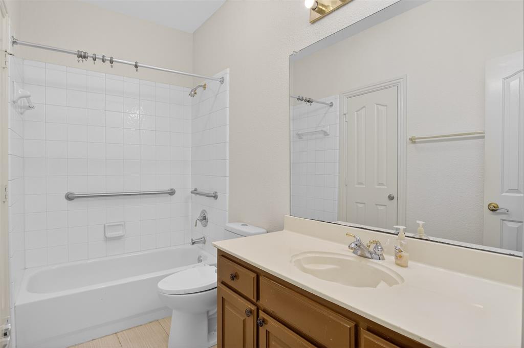 3716 Lowrey Way Plano, TX 75025 - Photo 20 of 28 a bathroom with a sink toilet vanity and shower
