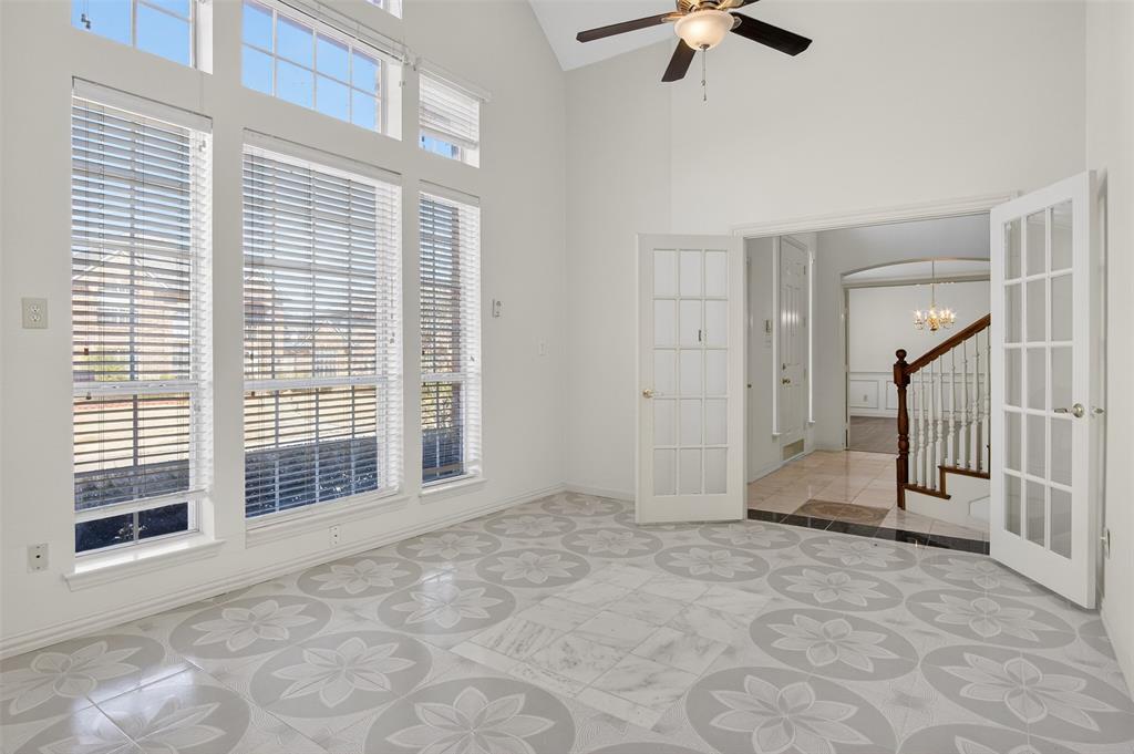 3716 Lowrey Way Plano, TX 75025 - Photo 3 of 28 a view of an empty room with a ceiling fan and window